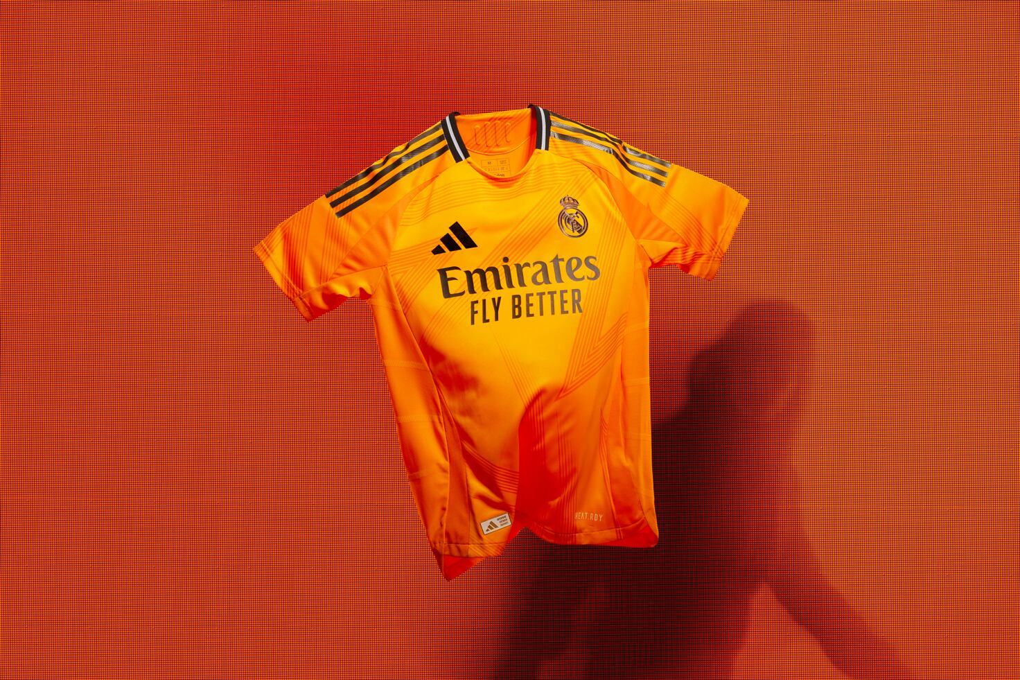 segunda equipacion real madrid naranja camiseta 2024-2025